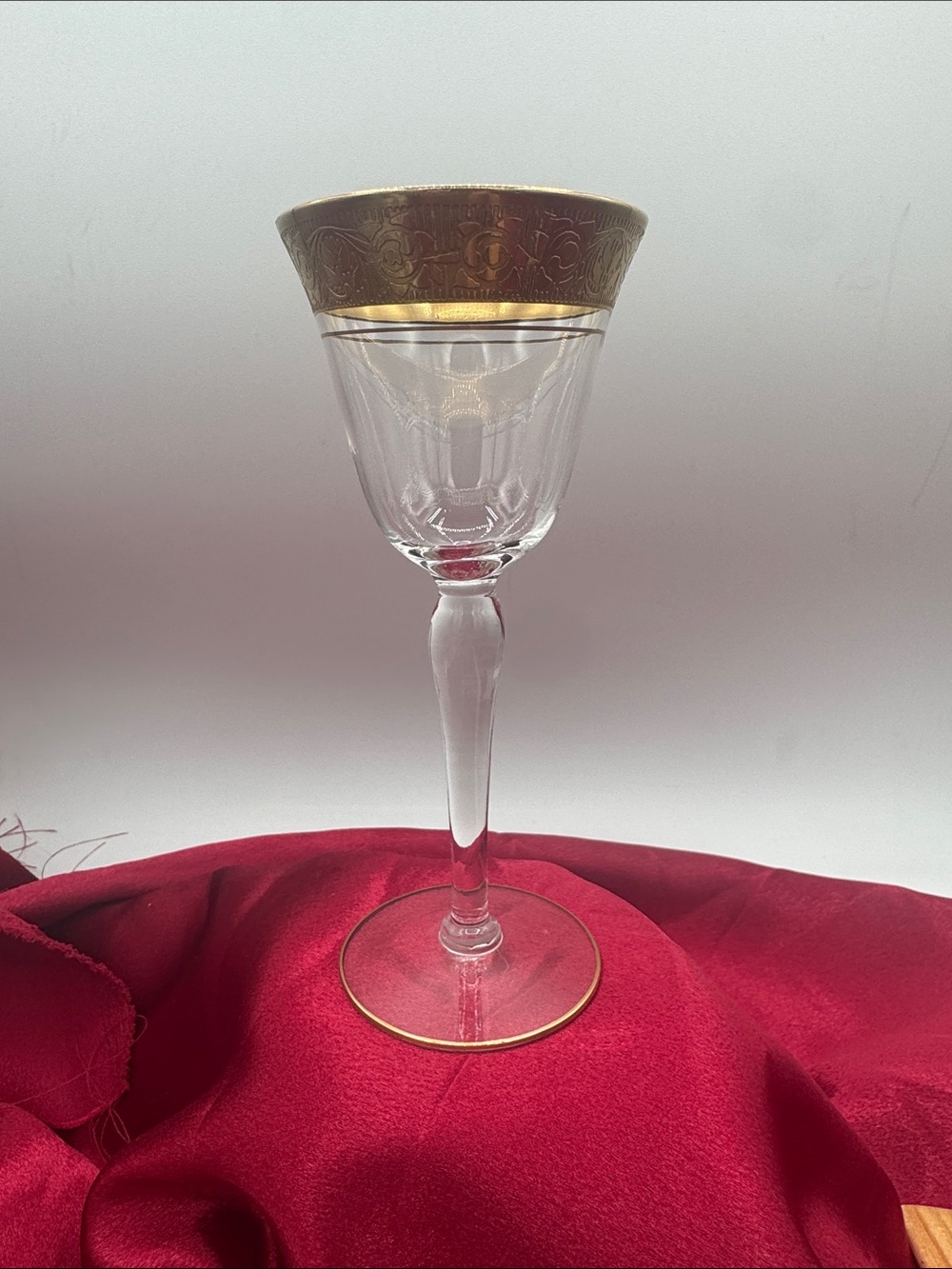 A vintage Tiffin gold-encrusted crystal wine/cordial glass, measuring 5 3/4”
